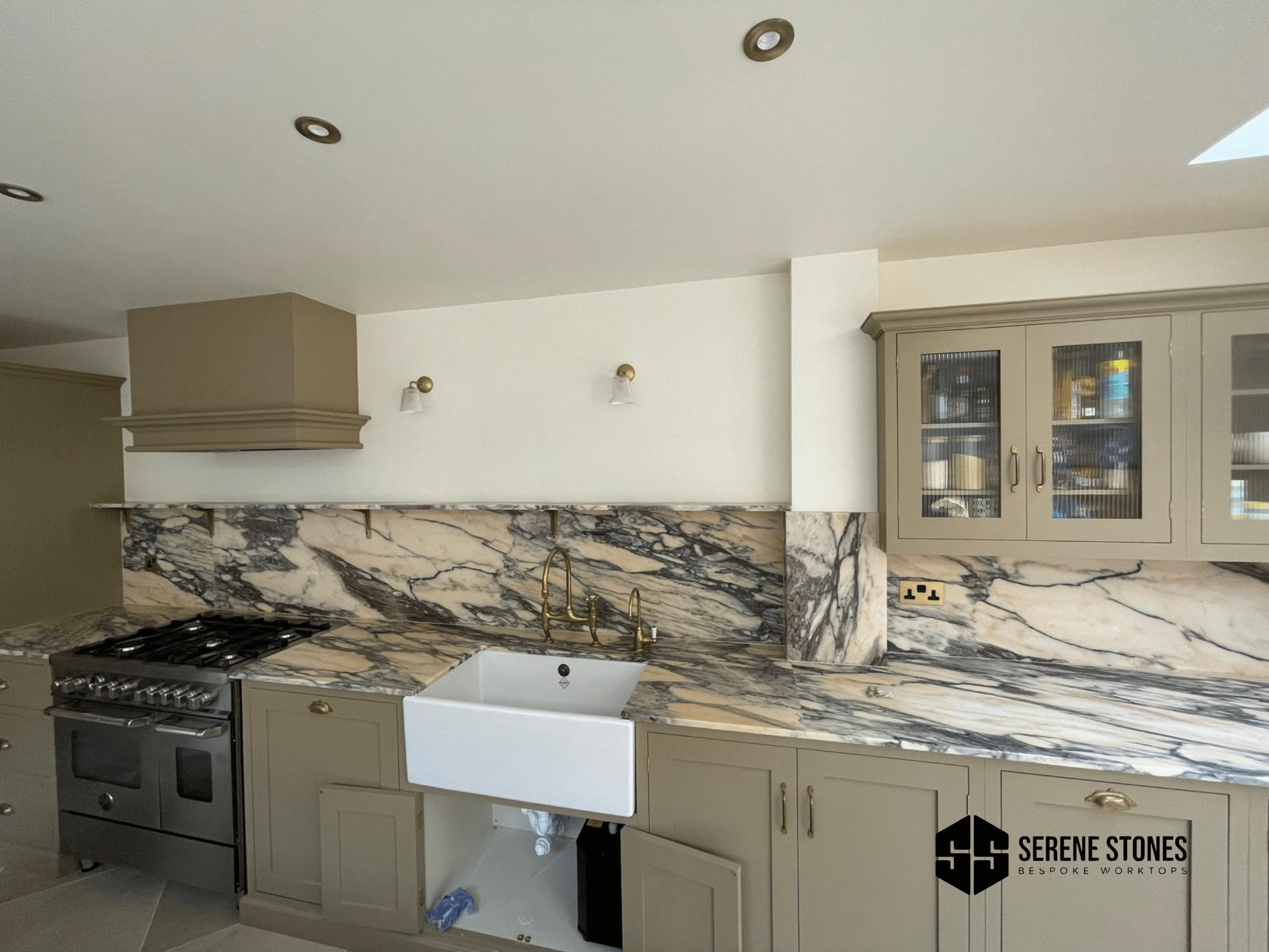 Glossy quartz worktop by Serene Stones for a modern kitchen finish.